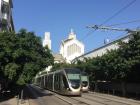 Trams passing by the cathedral in the center of Rabat