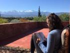 Reading "A House in Fez" with a view of the snowy mountains