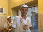 A pizza maker at a "Forno" (Italian for bakery)