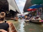 I took a boat ride on a floating market in Thailand, where you could buy food (BBQ chicken and fish, for example) and crafts (bracelets, paintings)