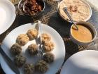 We ate our ker sangri (red dish) with roti bread and momos (steamed dumplings)