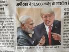 A newspaper cutting of President Trump alongside Prime Minister Modi