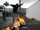A man jumping over a burning doll for good luck (photo credit: atlasobscura.com)
