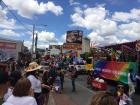 Sign on truck says: "Exist, Resist, Celebrate"