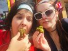 Guille and I eating these fried balls of Swiss chard at a street fair in Montevideo