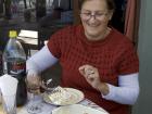 The mom of my mentor cutting tiramisu for dessert! She's diabetic and made this dessert without sugar. It was delicious!