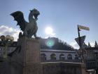 The famous Dragon Bridge in Ljubljana, with the castle in the background 