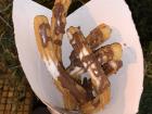 Delicious hot churros sprinkled with sugar and drizzled with chocolate are freshly made at little stands along the streets