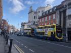 Buses come up the street one after another