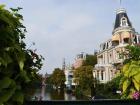 View of an Amsterdam street from one of the city's countless canal bridges