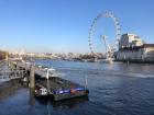 View over the River Thames toward the London Eye (the giant ferris wheel)