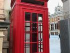 The red phone booth is a classic icon of London