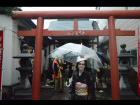 Out in the rain after watching a shrine ritual