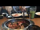 Cooking meat with friends at a Korean BBQ place
