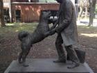 This is a statue of Hachiko being reunited with his master after 80 years