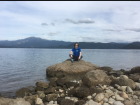 Sitting on a rock at Lake Tazawa