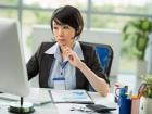 This is a women sitting at her desk in Japan