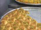 Kunefa; this is a warm, delicious sweet made with cheese and it has a crunchy top covered in sweet syrup