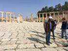 A tour guide in the city of Jerash explaining the purpose of the Roman ruins