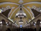 A view of the metro station with all the beautiful murals on the ceiling