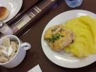 A typical lunch in Russia with dumplings, mashed potatoes and pork