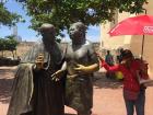 This is a statue of Saint Peter Claver helping somebody (featuring my tour guide)!