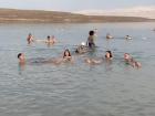 My friends and me floating away in the Dead Sea