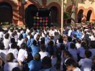 The older students watched a puppet show in the central patio