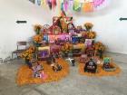 This is an altar put together by a classroom. Each student made their own little ofrenda out of cardboard and then they displayed them all as part of a larger ofrenda. 