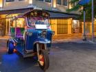 A unique vehicle called a tuk-tuk that is more appealing to tourists than Thai people