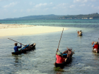 Women bringing firewood home by boat in Wakatobi, Sulawesi (Credit: Al Jazeera)