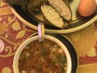 Bugis-style lunch: beef soup, an egg and steamed rice cakes