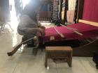 A woman weaving on a traditional loom