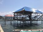 A stilt house being built