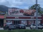 The local KFC which is advertising a pizza made out of chicken