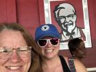 My mom and I posing with the KFC Colonel