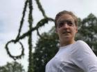 Celebrating Midsummer, a traditional Swedish holiday, with a flower crown and maypole (or "majstång" in Swedish)