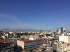 A tippy-toe view from the center of México City, with rooftops and mountains as far as the eye can see! 