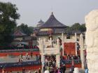 View of different temples and lots of visitors in the Temple of Heaven area