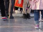 Feet of people praying on the center stone slab