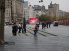 City worker sweeping the steps for garbage