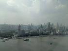 Office windows look across the Huangpu River