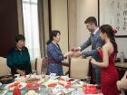 Married couple greets tables for a toast