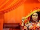 This women dressed up for pictures in traditional Chinese wedding garments