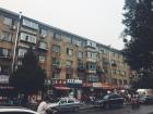 The street where I often get noodles for lunch is busy with bikes, cars and people