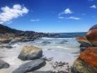 This is the Bay of Fires in Tasmania. The vibrant orange moss on the rocks was so stunning!