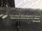 Standing in front of the Welsh Government building