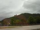 A castle sitting on a hill overlooking the Rhine River