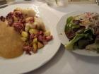 My dinner included a dish that included roasted pork, apples, and potato dumplings, as well as apple sauce and a salad