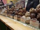 One stall is selling what looks like cookies mashed together into balls of sugar